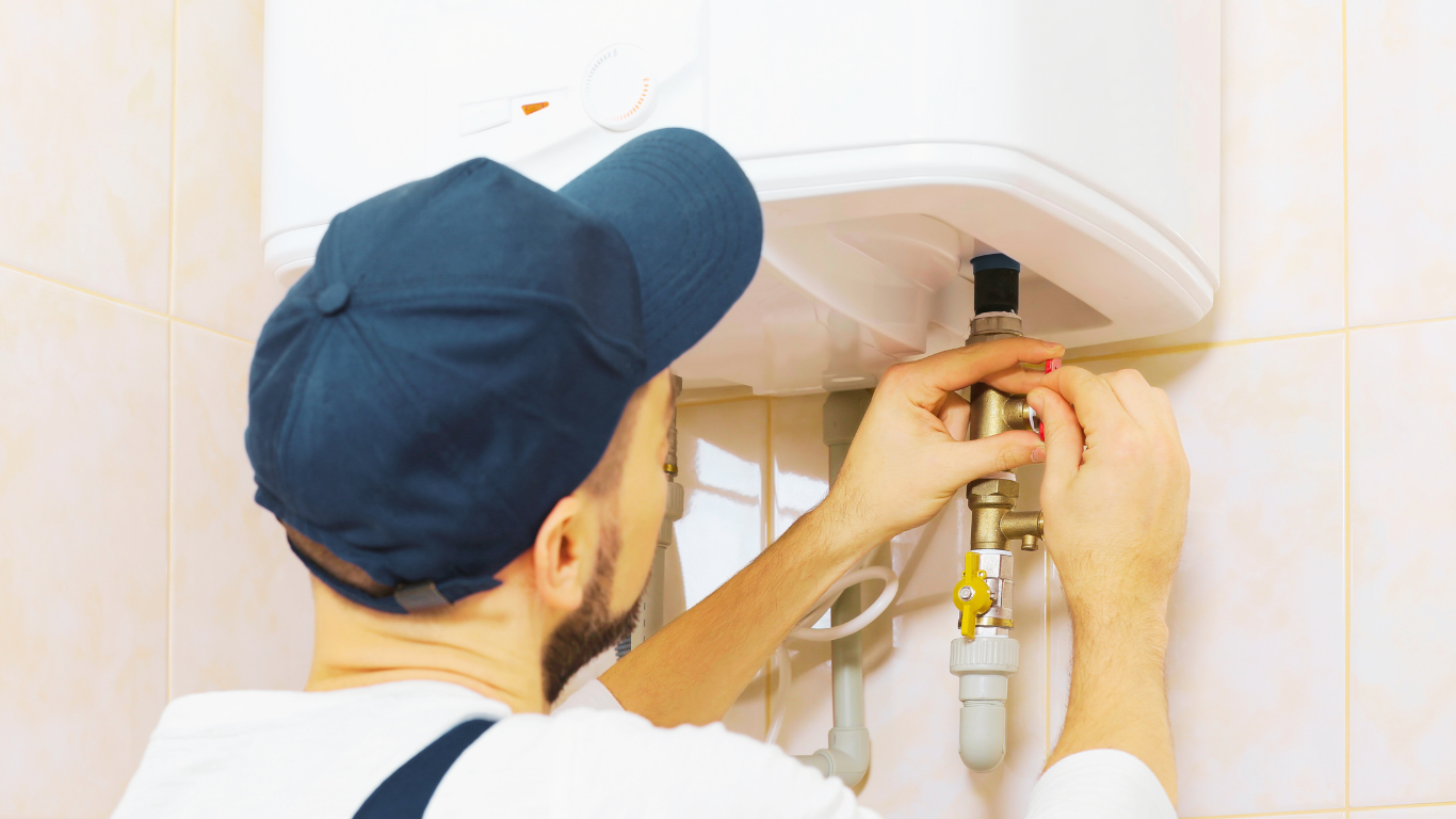 Plumber replacing water heater valve to prevent home damage